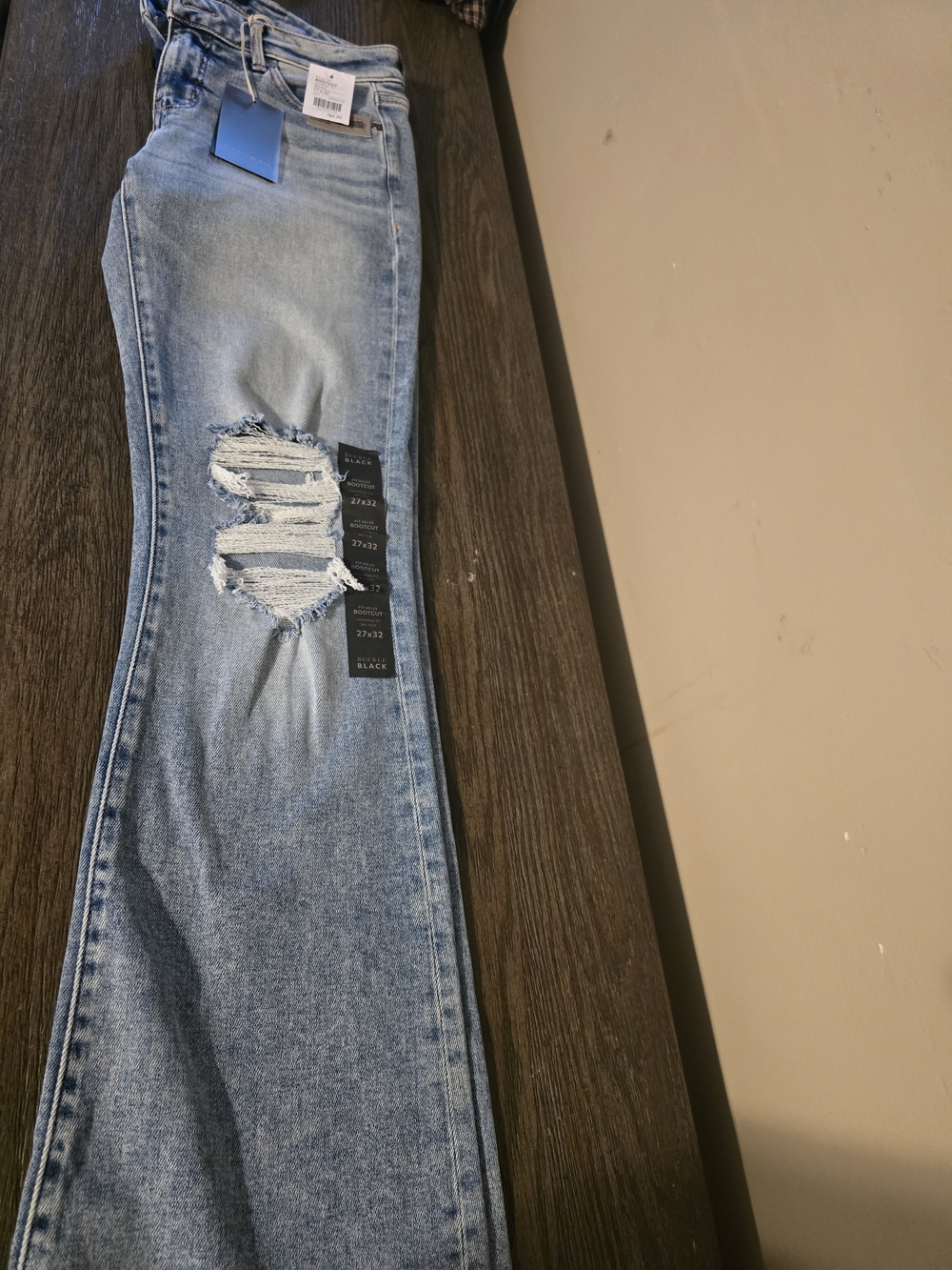 Buckle Light Wash Blue Bootcut Jeans with Knee Distress